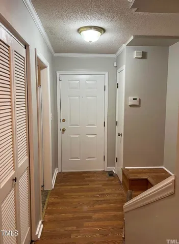 a view of room with hardwood floor