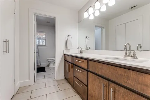 a outdoor space with patio couches and a dining table and chairs with wooden floor