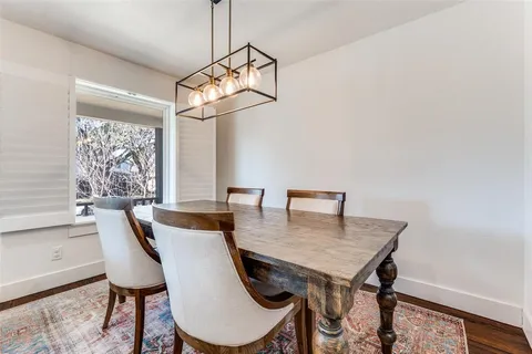 a view of a dining room with furniture and window