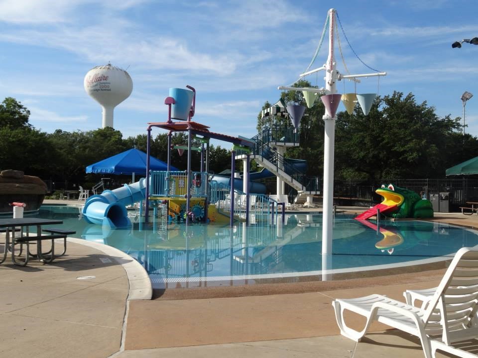 4624 Verone Street Bellaire, TX 77401 - Photo 26 of 33 a childrens park with lots of swings and slides