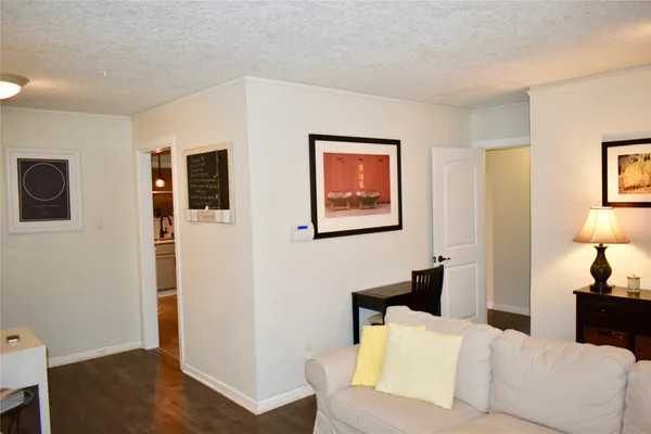 a living room with furniture and a lamp