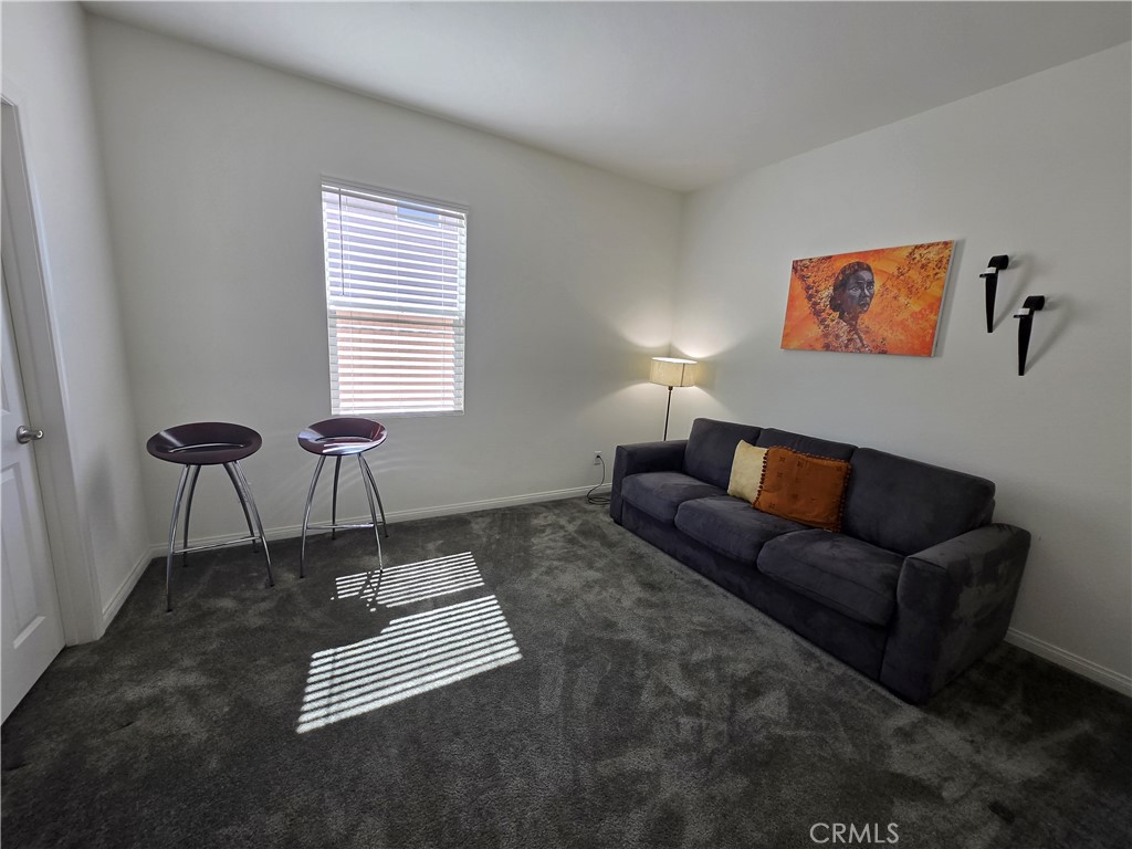 7900 Raincross Court Riverside, CA 92507 - Photo 12 of 21 a living room with furniture and a window