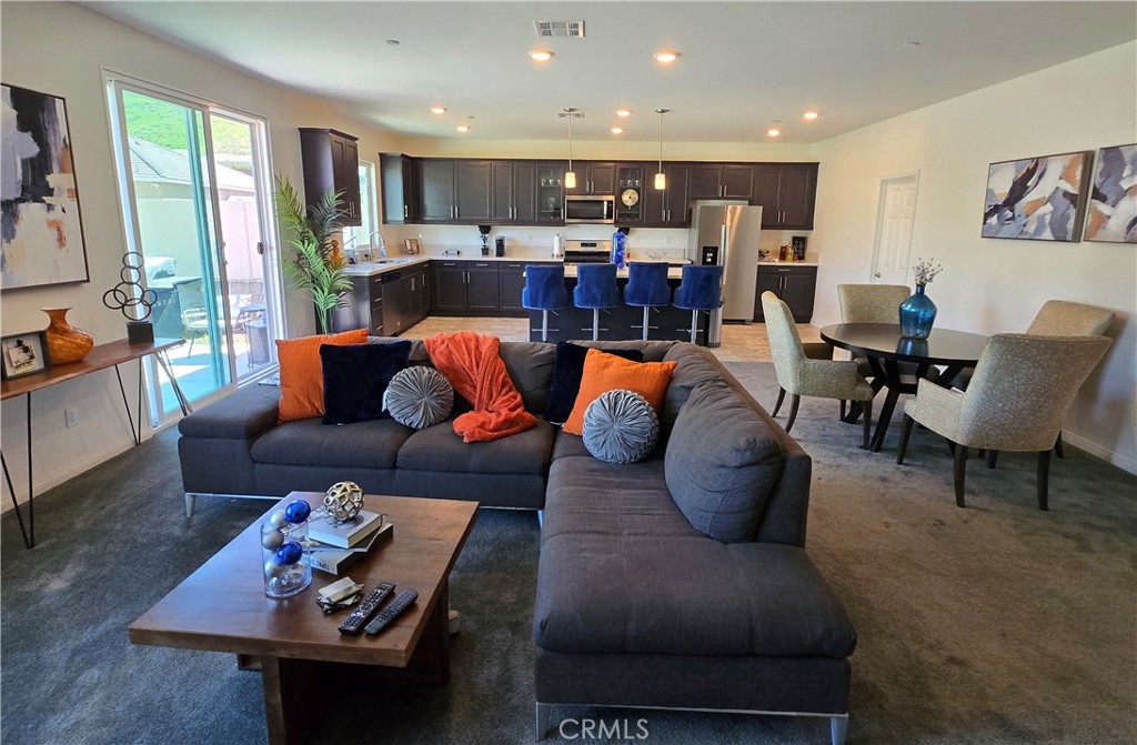 7900 Raincross Court Riverside, CA 92507 - Photo 17 of 21 a living room with furniture kitchen view and a large window