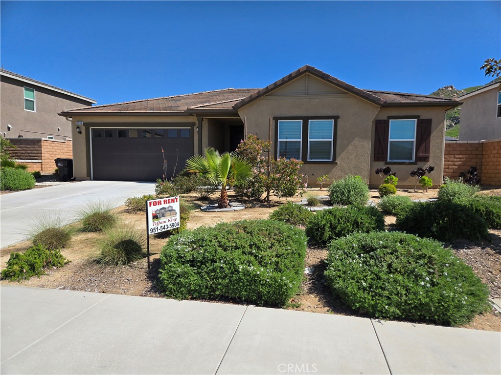 7900 Raincross Court Riverside, CA 92507 - Photo 2 of 21 a front view of a house with a yard