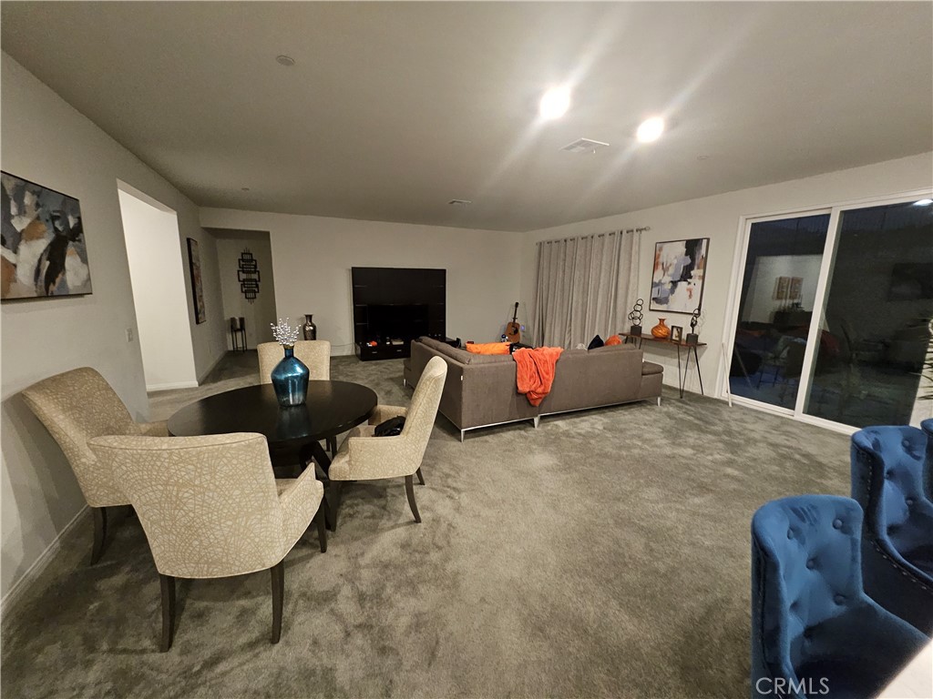 7900 Raincross Court Riverside, CA 92507 - Photo 5 of 21 a living room with furniture and a flat screen tv