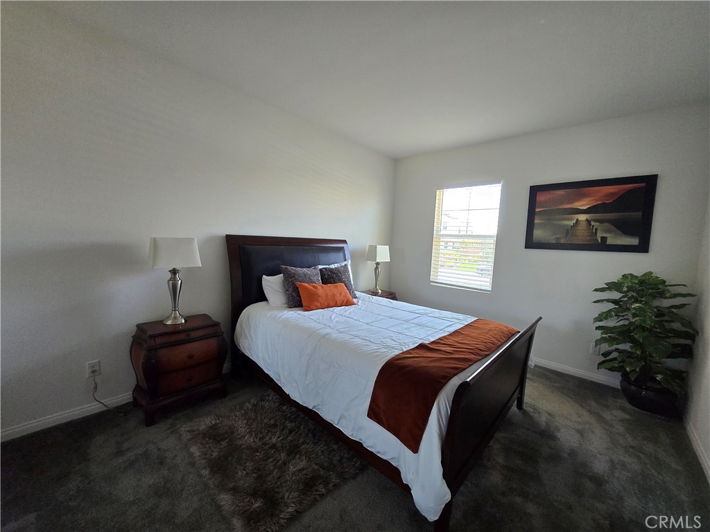 7900 Raincross Court Riverside, CA 92507 - Photo 7 of 21 a bedroom with a bed and window