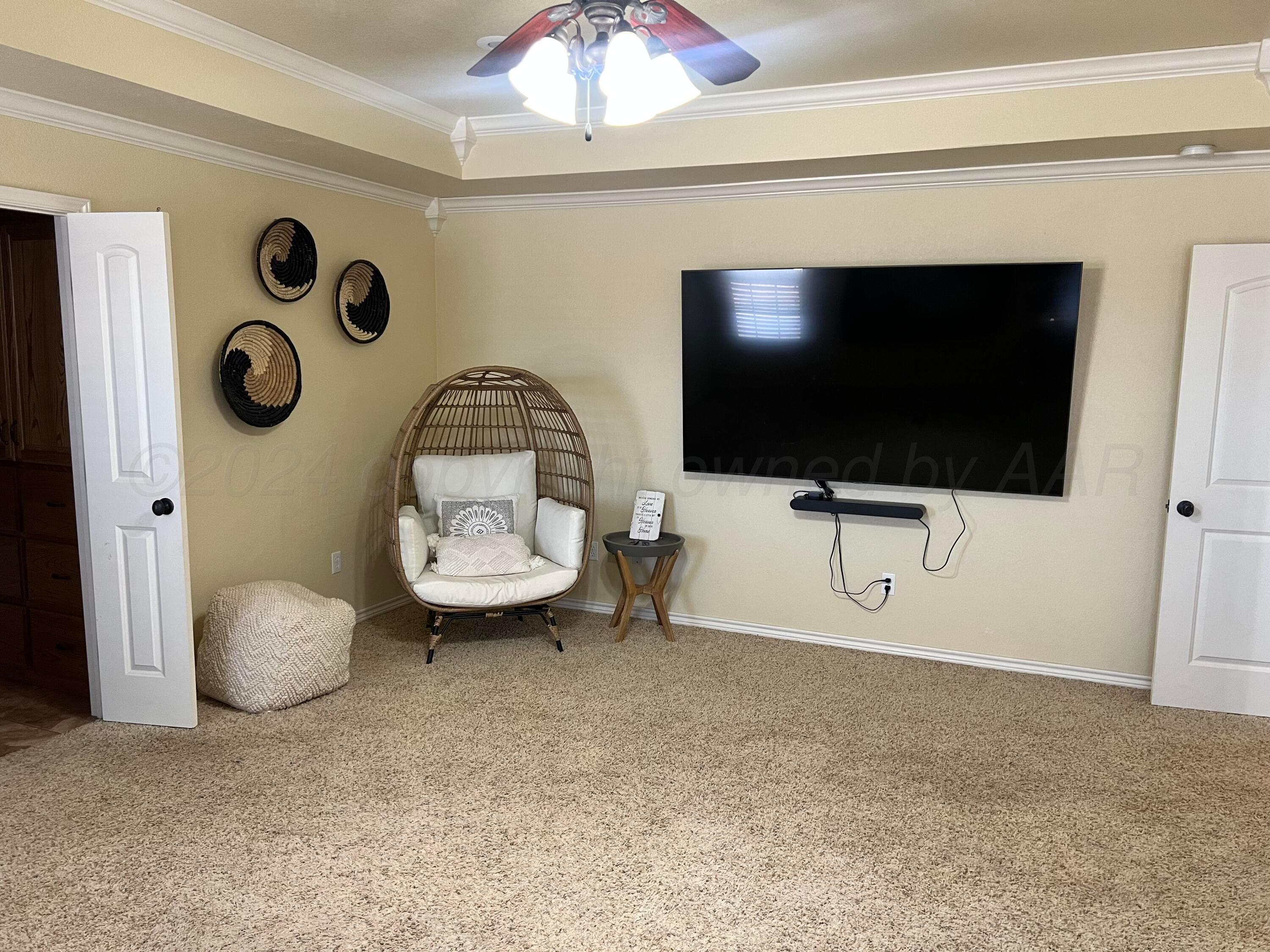 830 Baltimore Drive Hereford, TX 79045 - Photo 22 of 46 a living room with a flat screen tv and a table