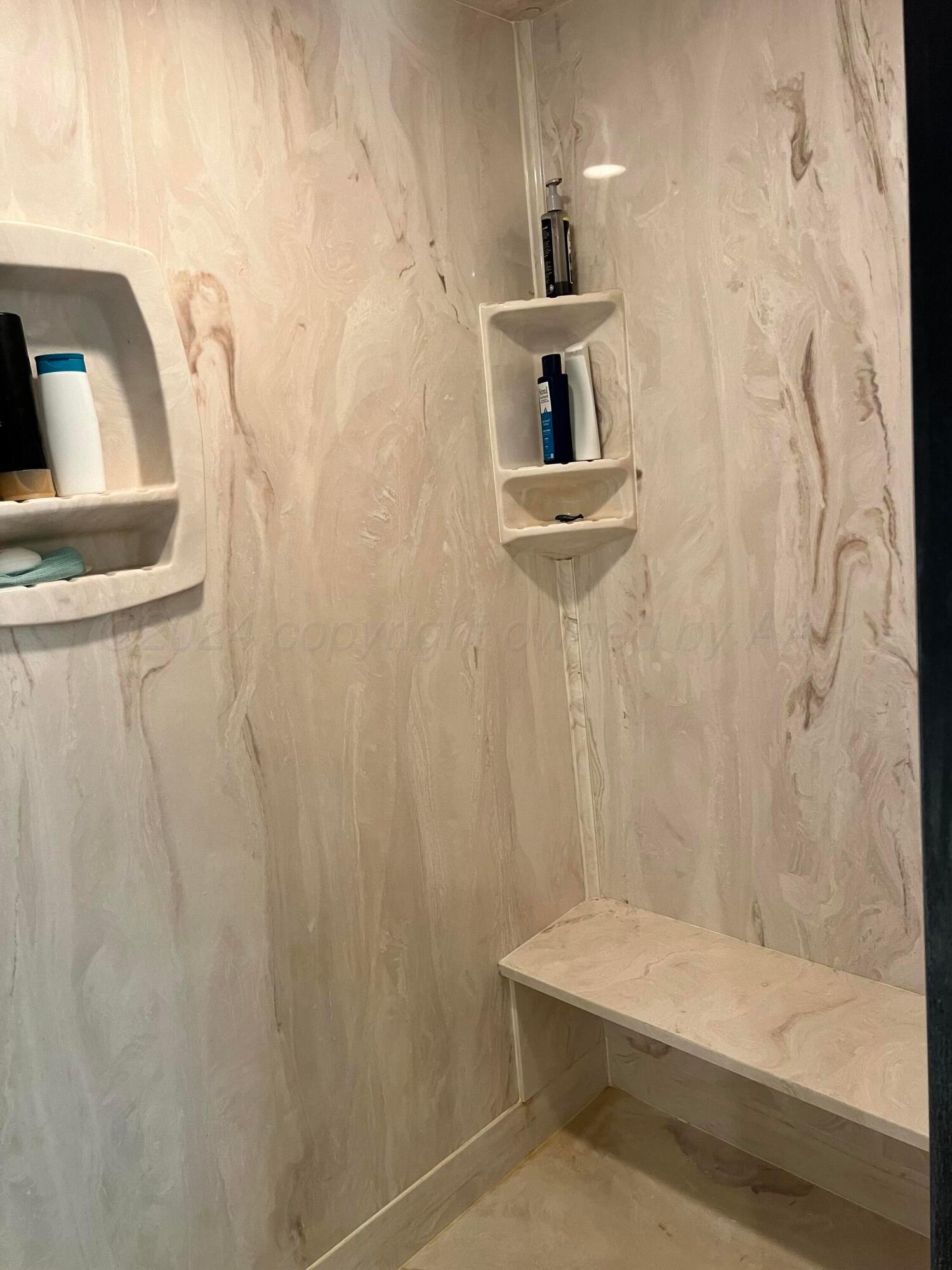 830 Baltimore Drive Hereford, TX 79045 - Photo 26 of 46 a bathroom with a shower curtain and a sink