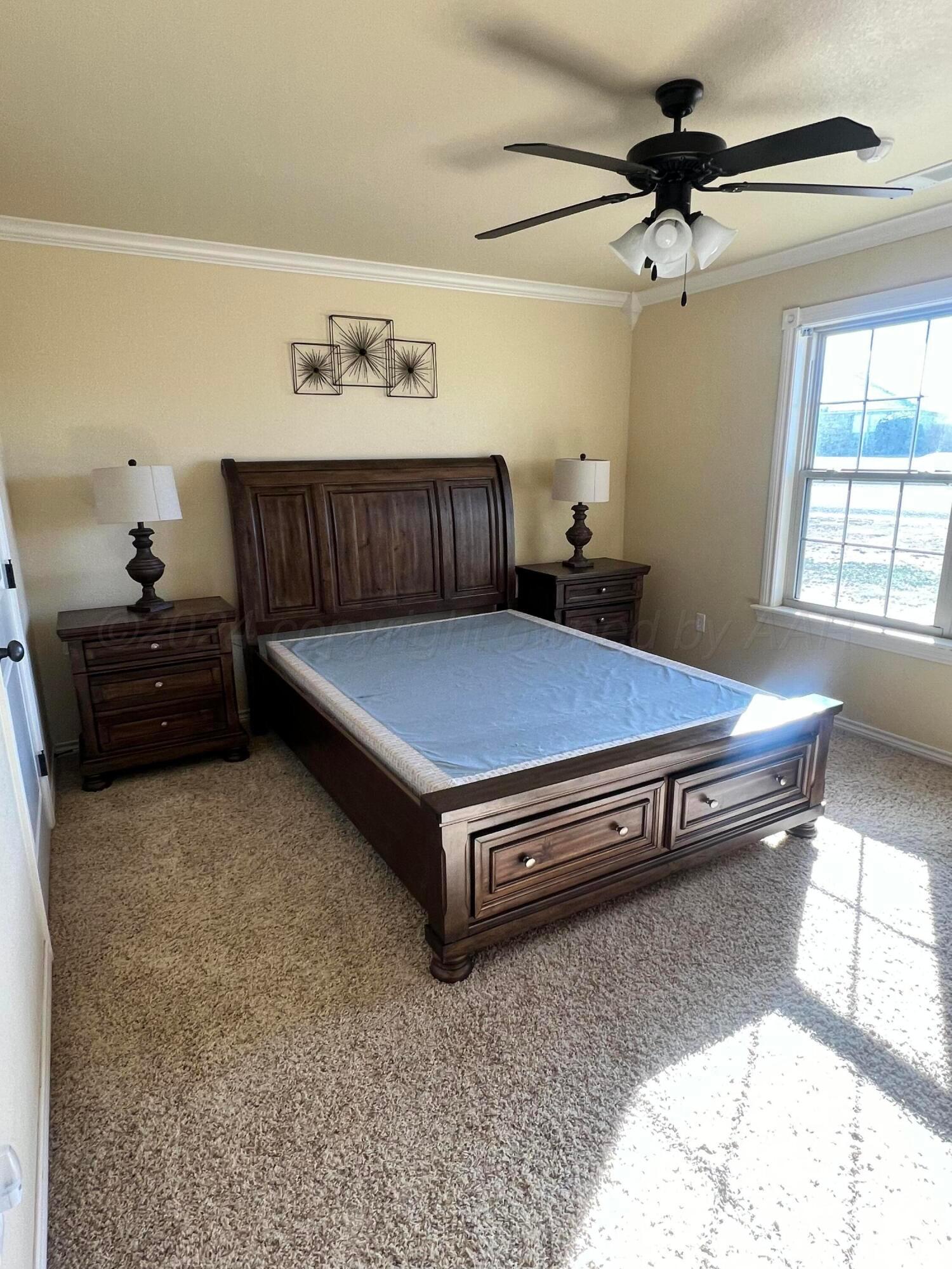 830 Baltimore Drive Hereford, TX 79045 - Photo 35 of 46 a bedroom with a bed and window