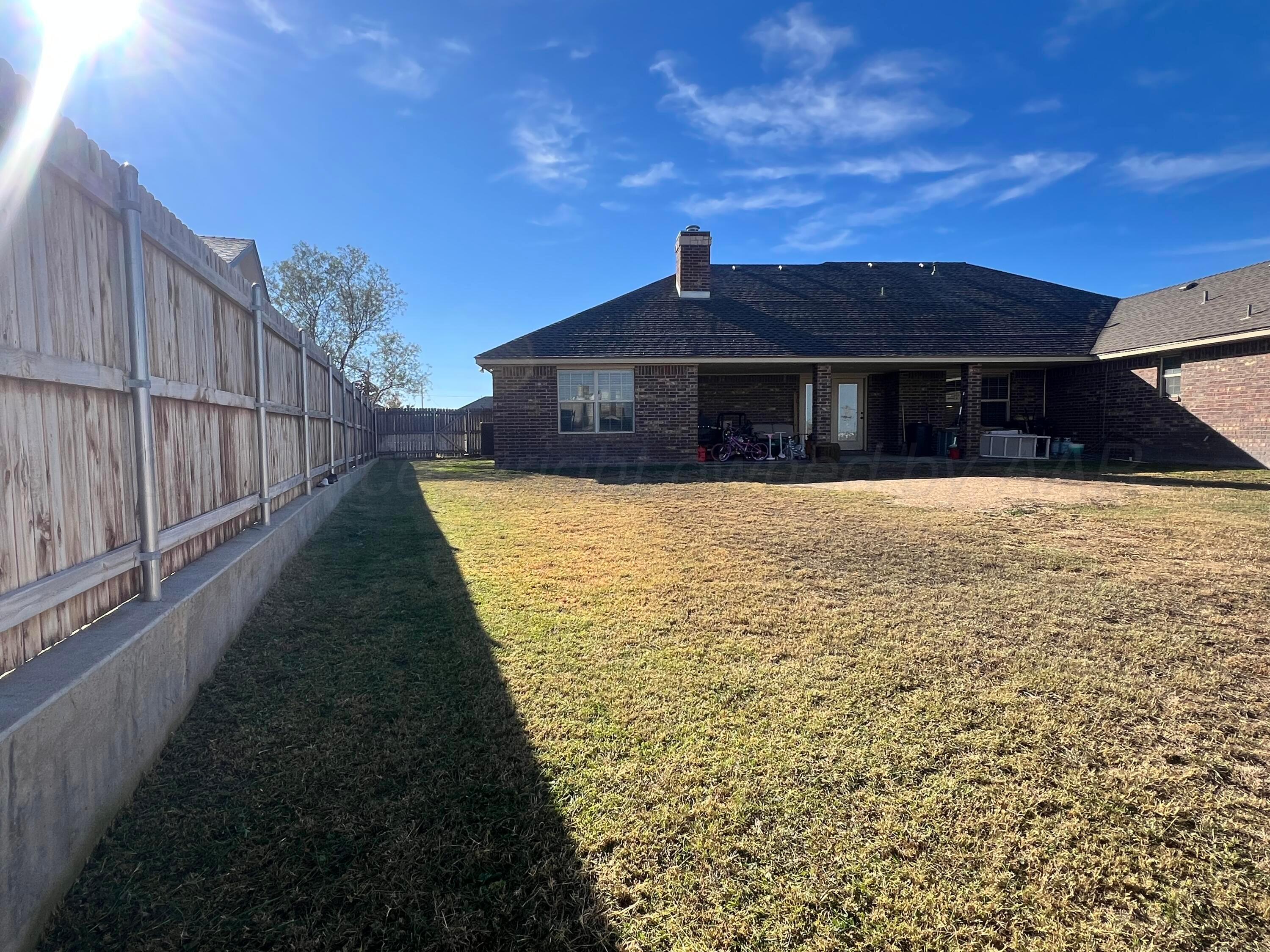 830 Baltimore Drive Hereford, TX 79045 - Photo 7 of 46 a view of a house with wooden fence