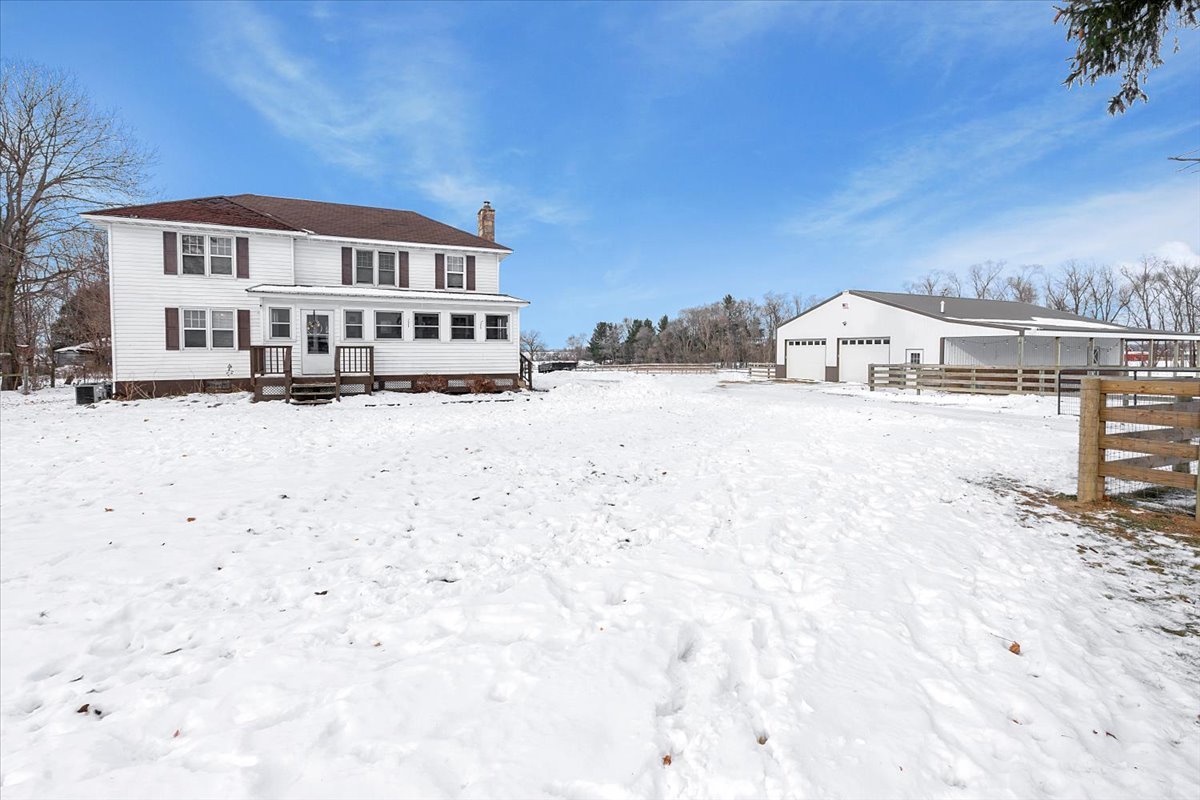 21626 Oak Grove Road Harvard, IL 60033 - Photo 1 of 34 a view of a house with wooden fence