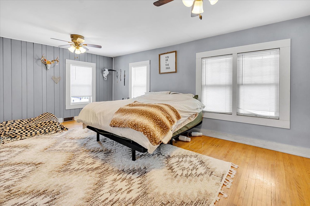 21626 Oak Grove Road Harvard, IL 60033 - Photo 12 of 34 a bedroom with a bed lamps and window