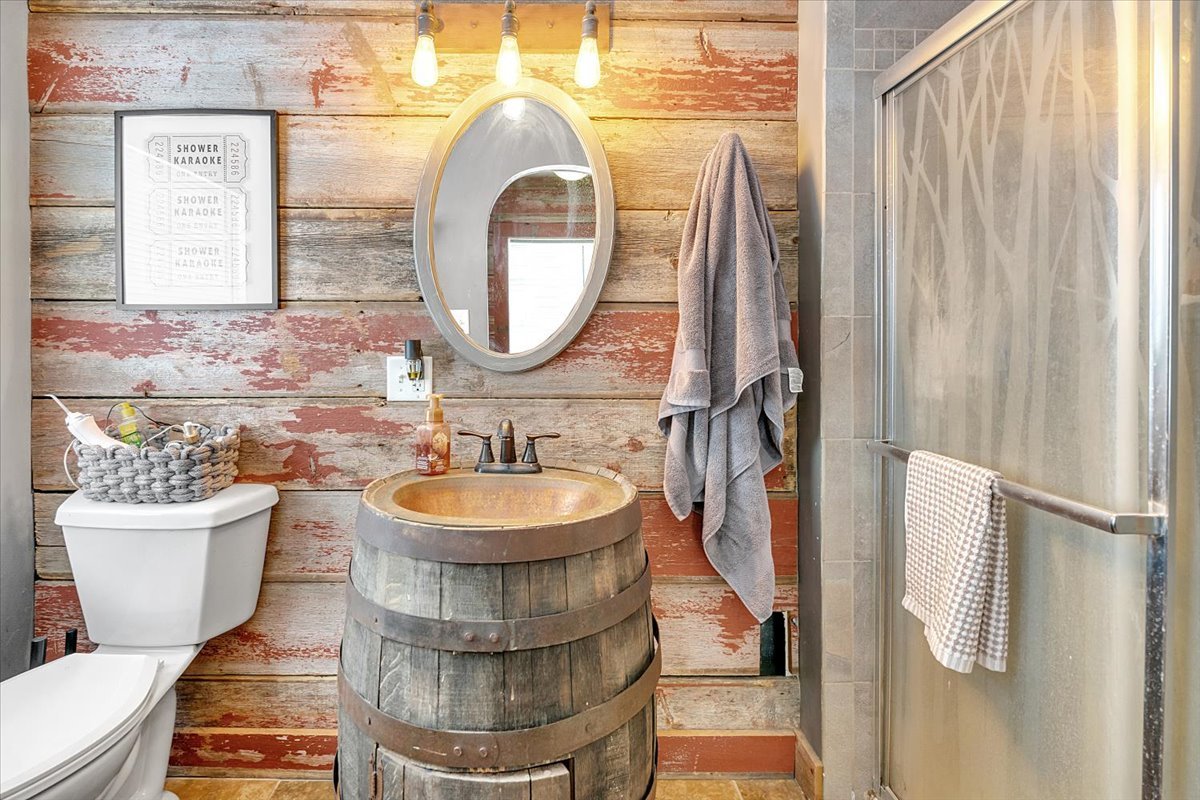 21626 Oak Grove Road Harvard, IL 60033 - Photo 16 of 34 a bathroom with a sink a mirror a vanity and a window