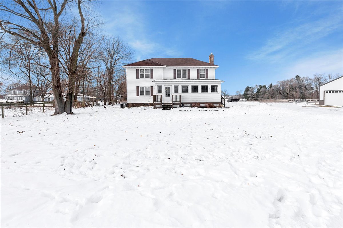 21626 Oak Grove Road Harvard, IL 60033 - Photo 3 of 34 a view of a house with snow on the road