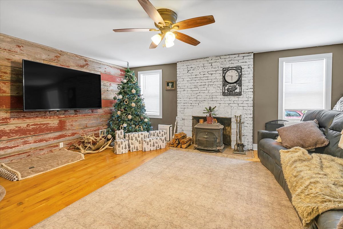 21626 Oak Grove Road Harvard, IL 60033 - Photo 4 of 34 a living room with furniture and a flat screen tv