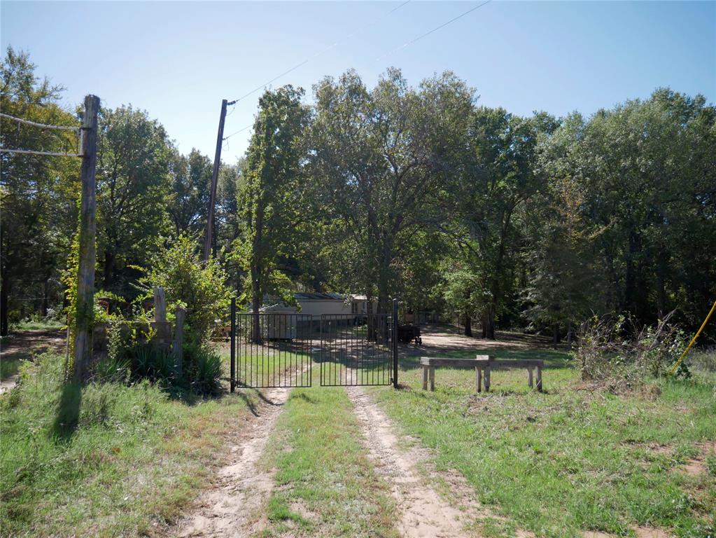 9948 Richardson Road Athens, TX 75752 - Photo 11 of 24 a swimming pool with outdoor seating and trees