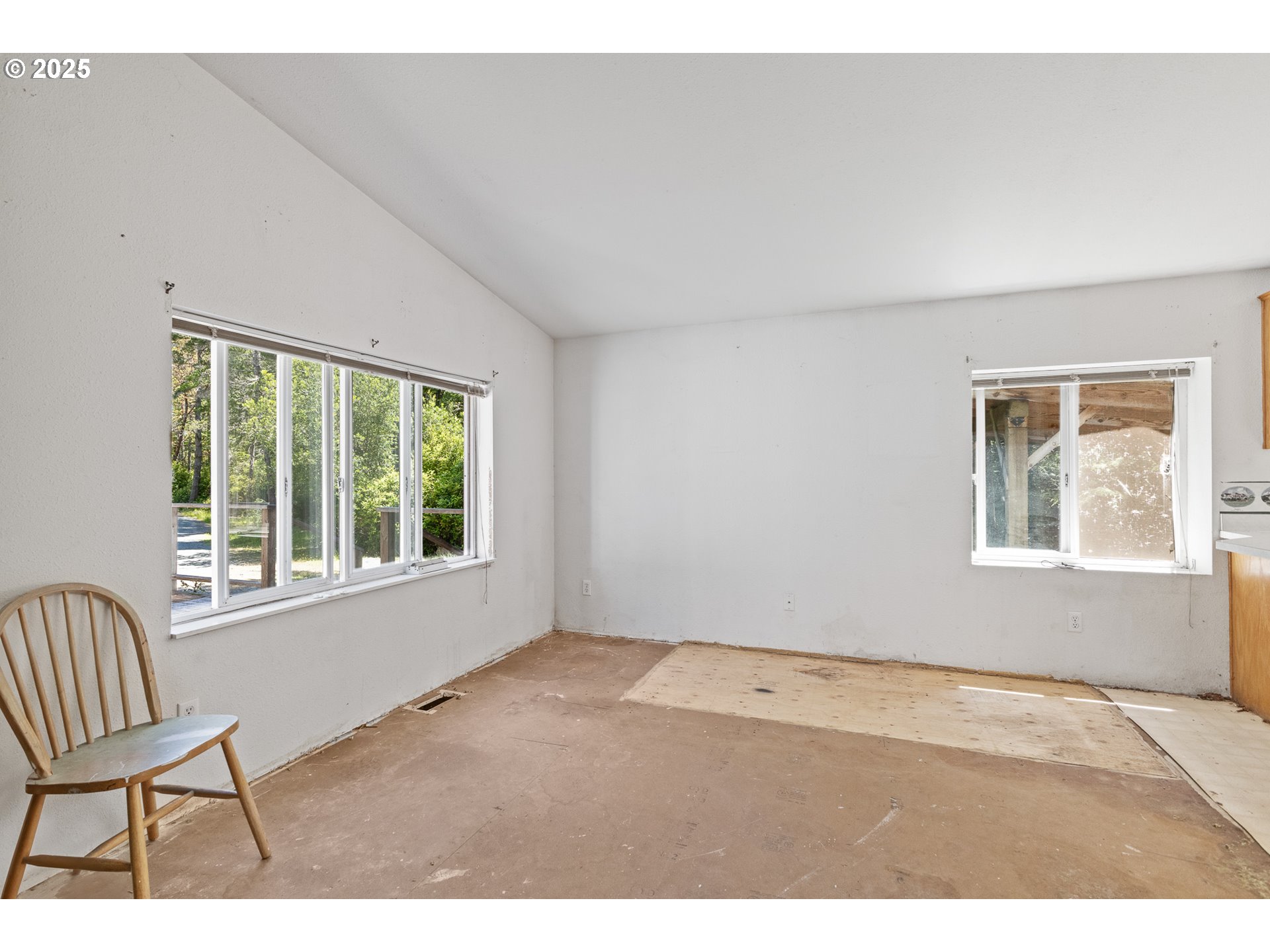 58897 Constance Drive Bandon, OR 97411 - Photo 14 of 37 a view of an empty room and window