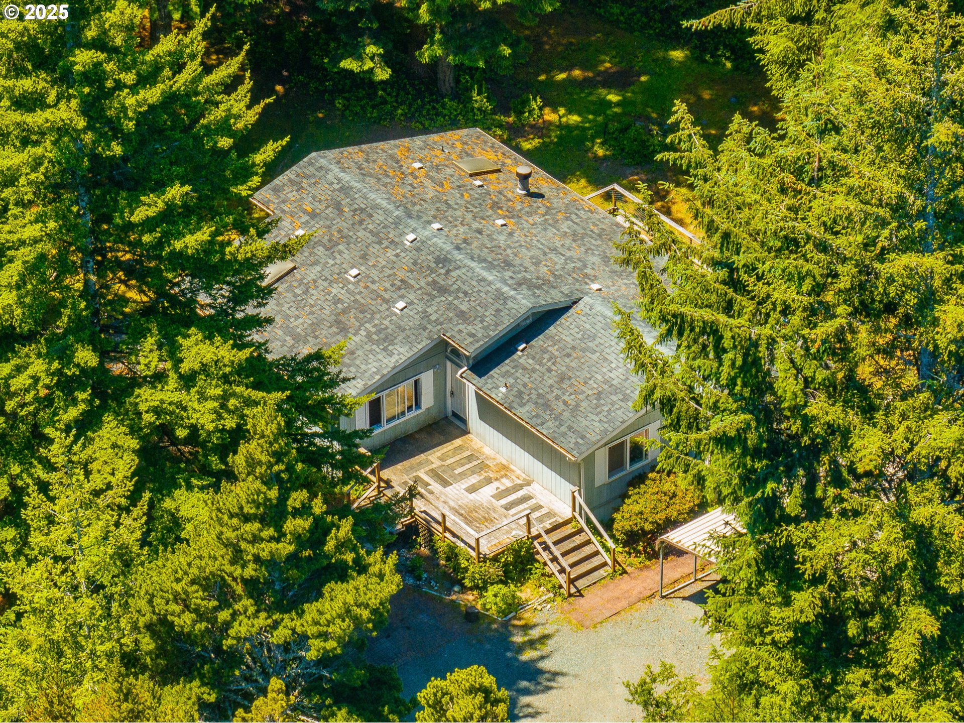 58897 Constance Drive Bandon, OR 97411 - Photo 26 of 37 view of a house with a yard