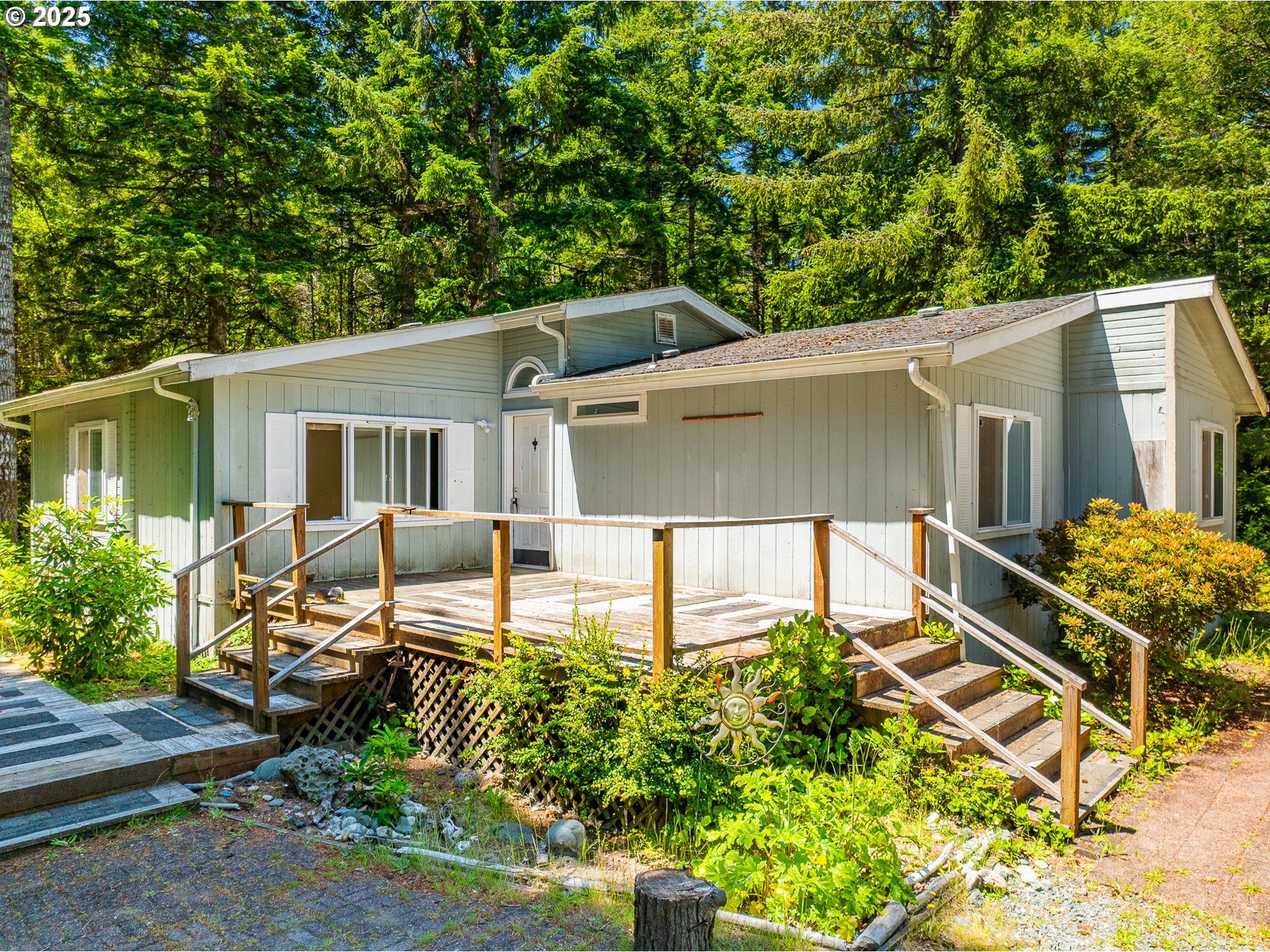 58897 Constance Drive Bandon, OR 97411 - Photo 4 of 37 front view of a house with a patio