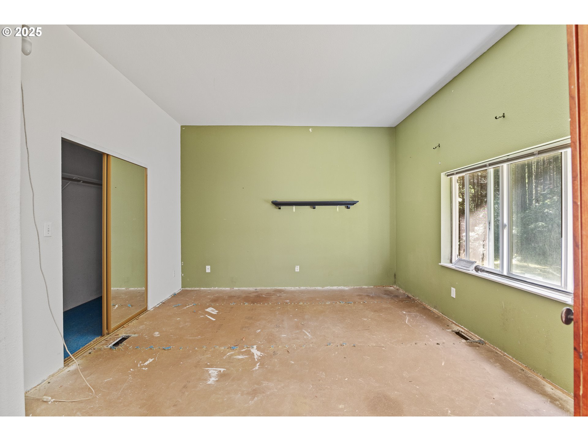 58897 Constance Drive Bandon, OR 97411 - Photo 8 of 37 a view of an empty room with a window
