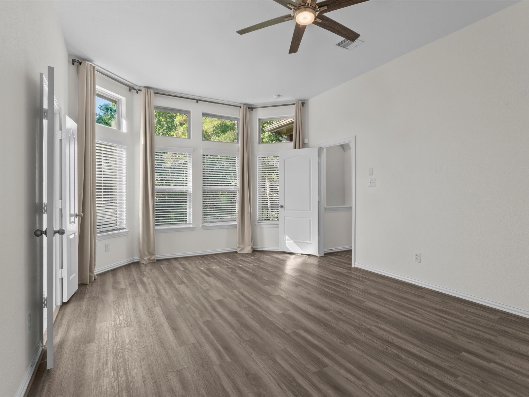 4746 Misty Ranch Drive Spring, TX 77386 - Photo 25 of 49 Oversized primary bedroom with large picture windows that bring in abundant natural light and create a bright, inviting retreat.