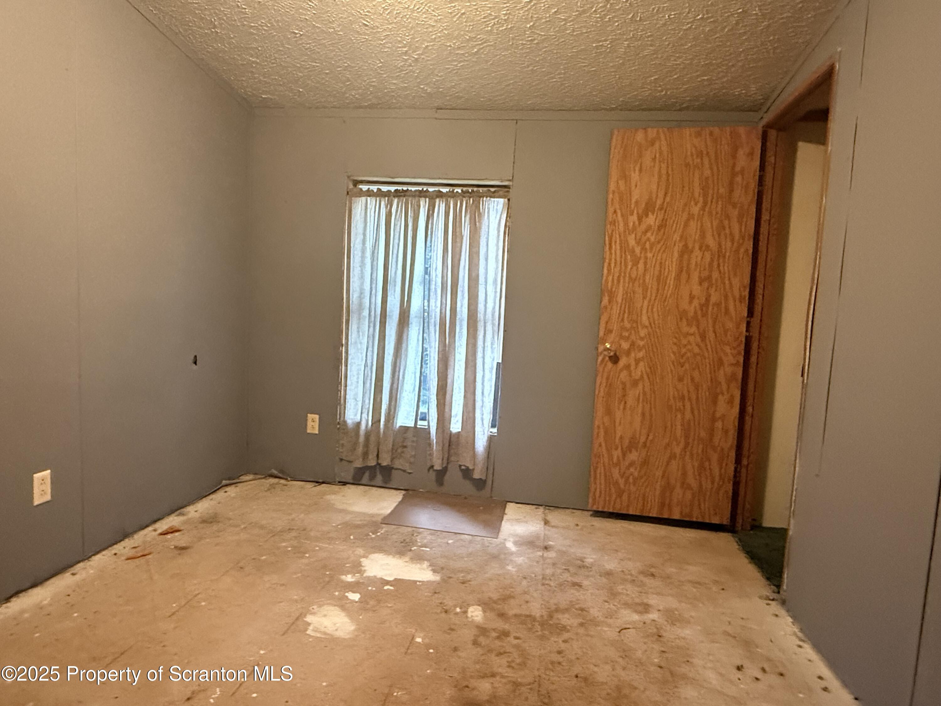 1218 Campsite Road Thompson, PA 18465 - Photo 11 of 26 an empty room with windows