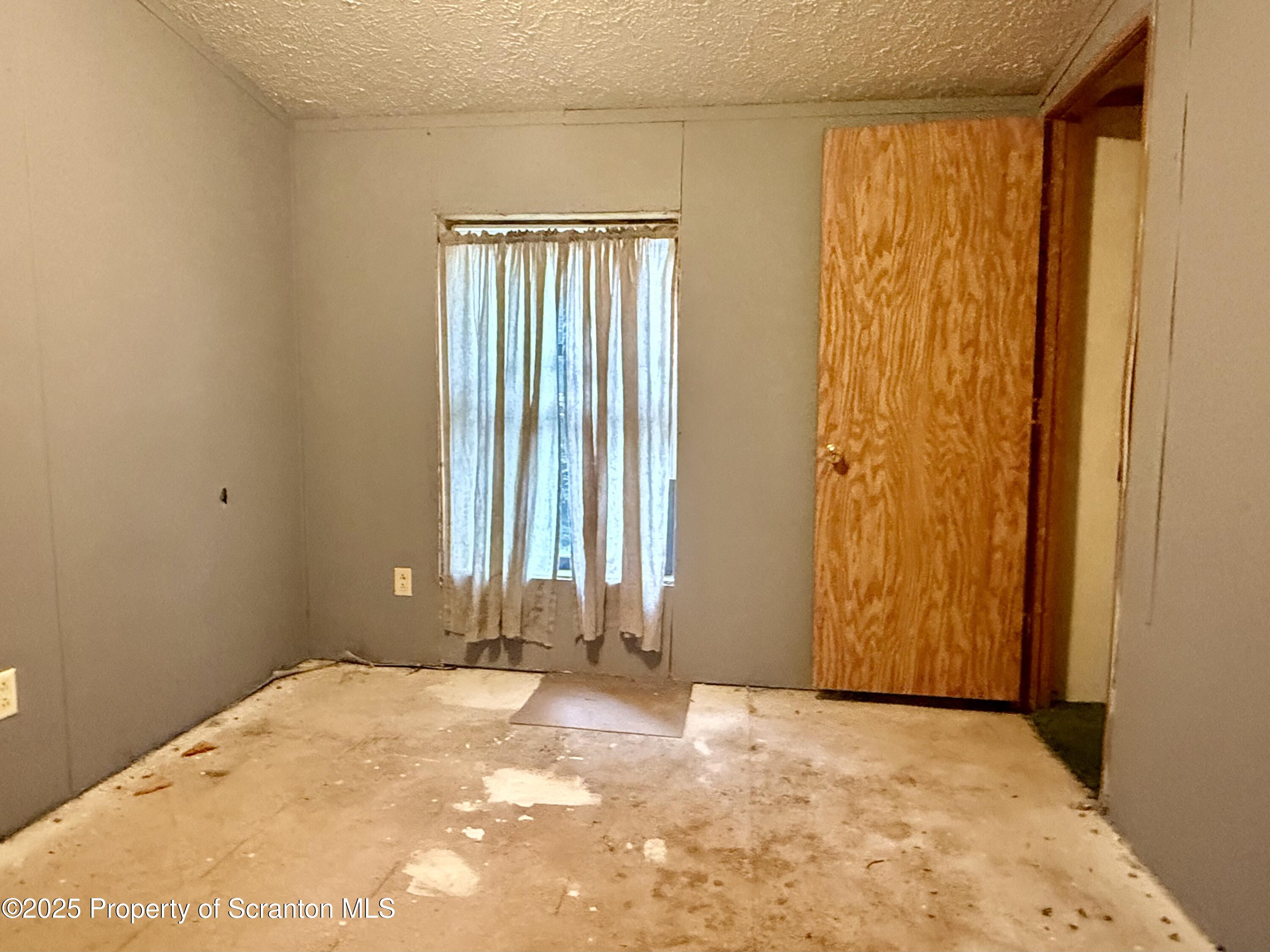 1218 Campsite Road Thompson, PA 18465 - Photo 14 of 26 a view of a room with a window and a bathroom