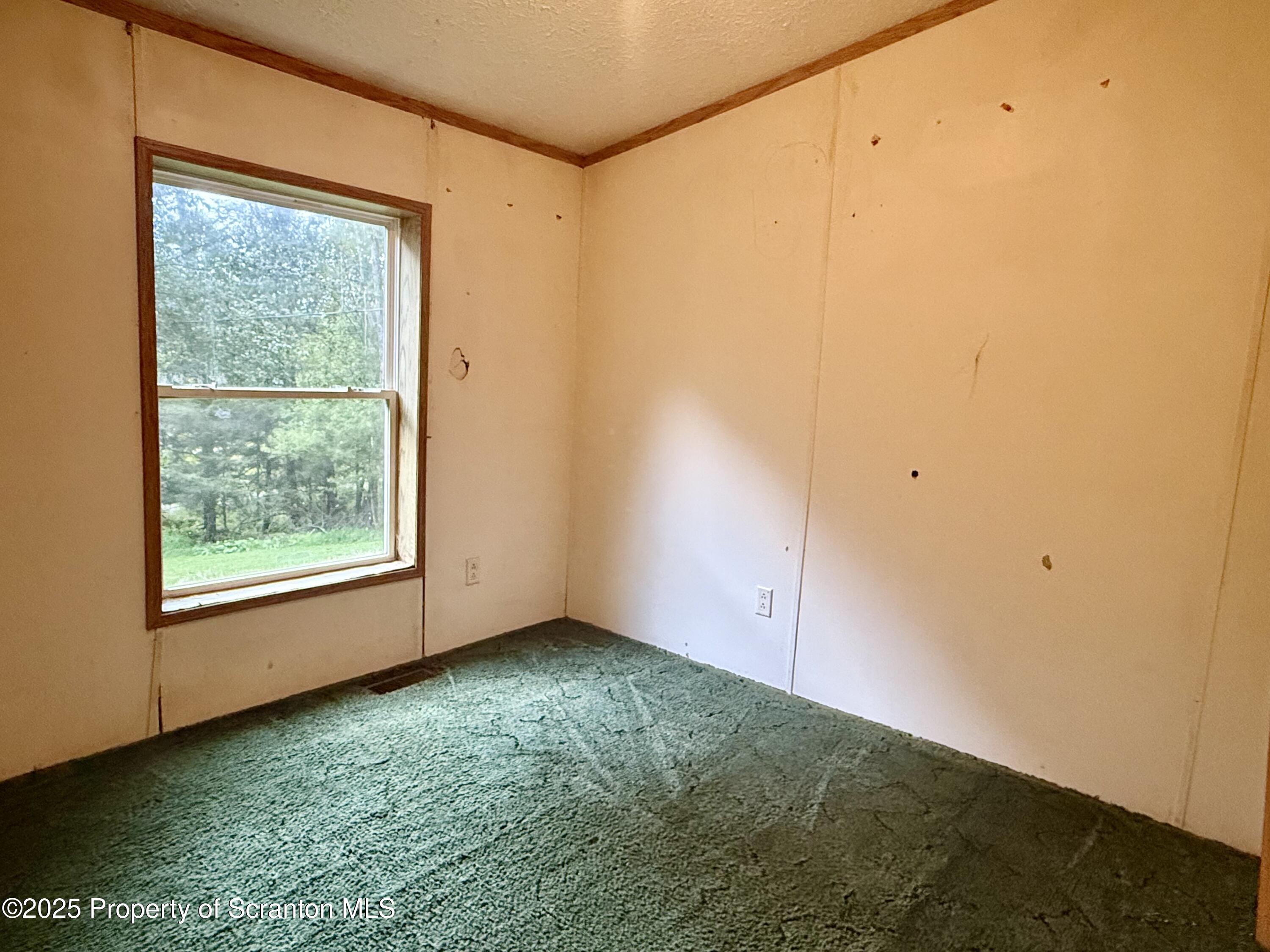 1218 Campsite Road Thompson, PA 18465 - Photo 15 of 26 a view of room with window