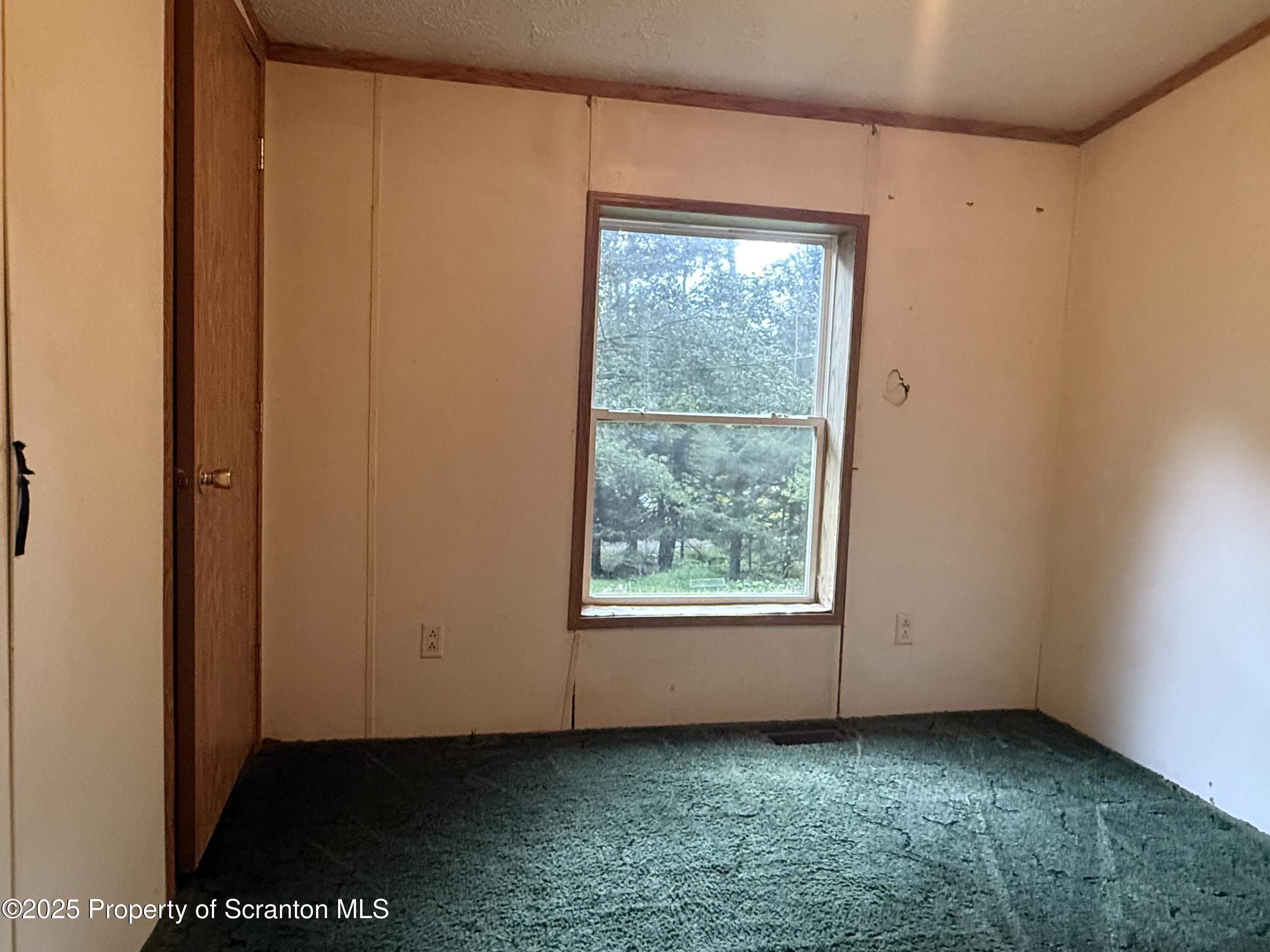 1218 Campsite Road Thompson, PA 18465 - Photo 16 of 26 an empty room with a window