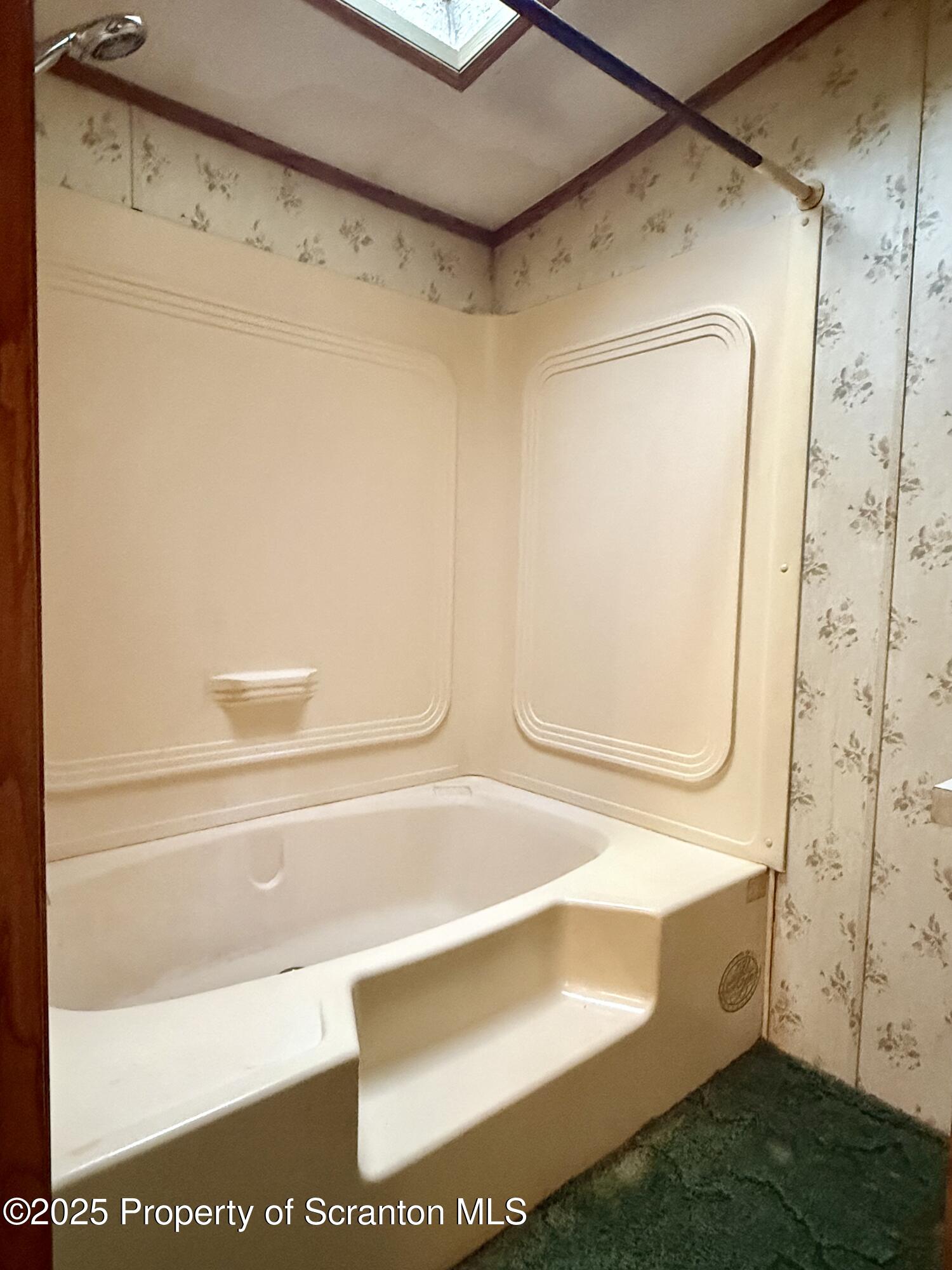1218 Campsite Road Thompson, PA 18465 - Photo 19 of 26 a bathroom with a bathtub and a shower