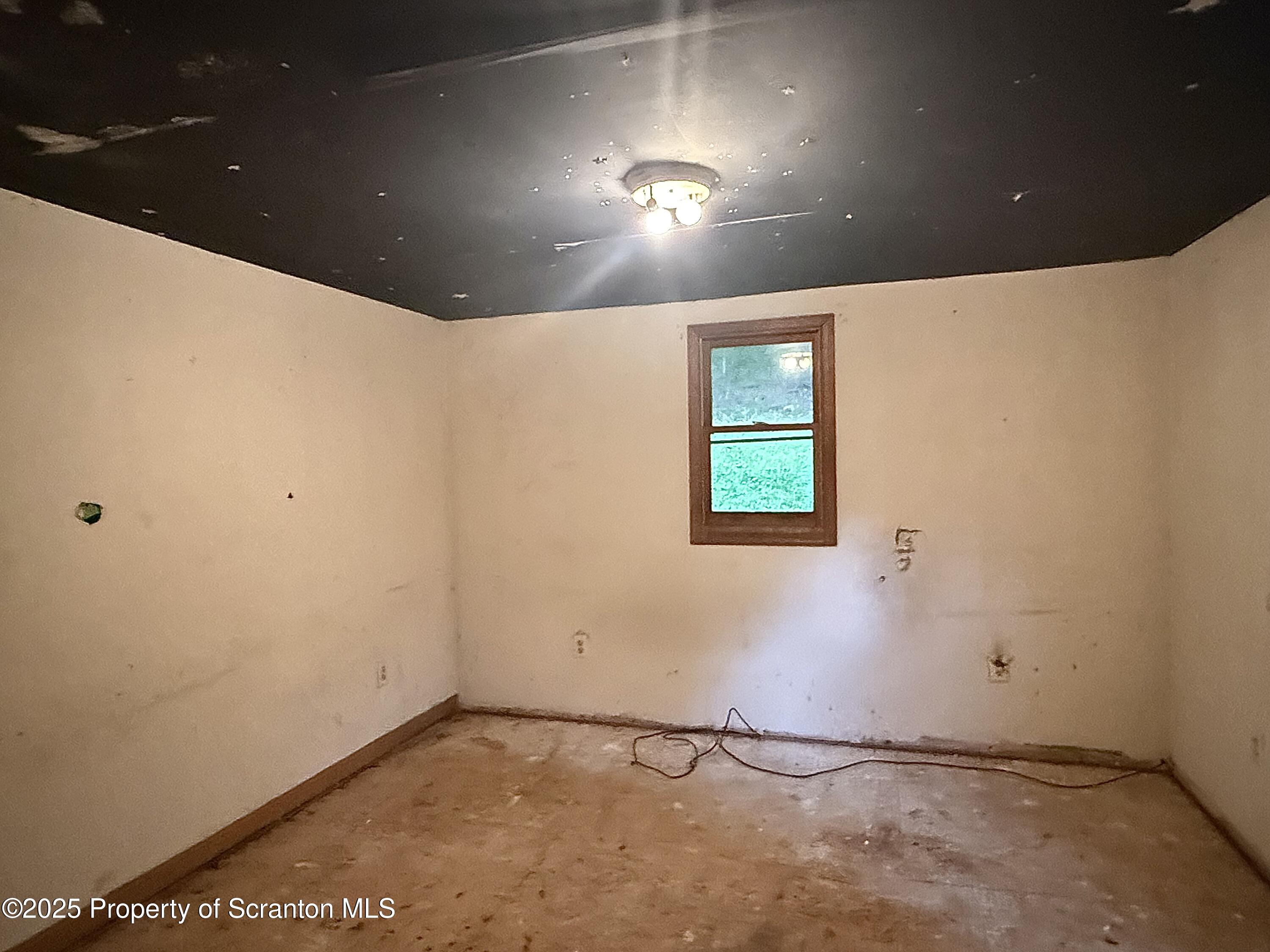 1218 Campsite Road Thompson, PA 18465 - Photo 9 of 26 a view of an empty room