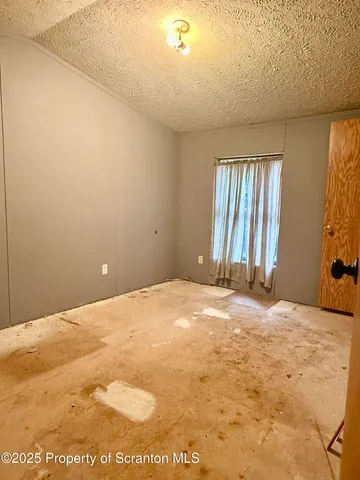 a view of empty room with windows