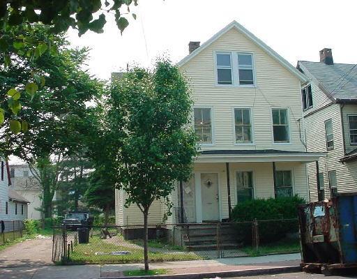 210 Newfield Avenue Bridgeport, CT 06607 - Photo 1 of 1 a front view of a house with a yard