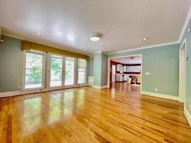 2396 Lavista Road Northeast Atlanta, GA 30329 - Photo 11 of 28 a view of an empty room with window and wooden floor
