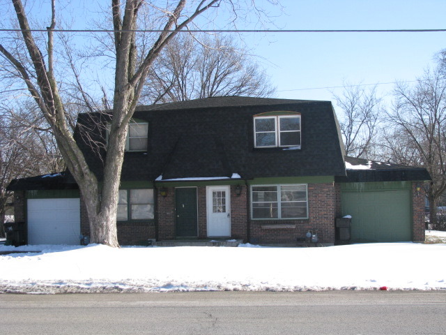 a black and white photo of a house