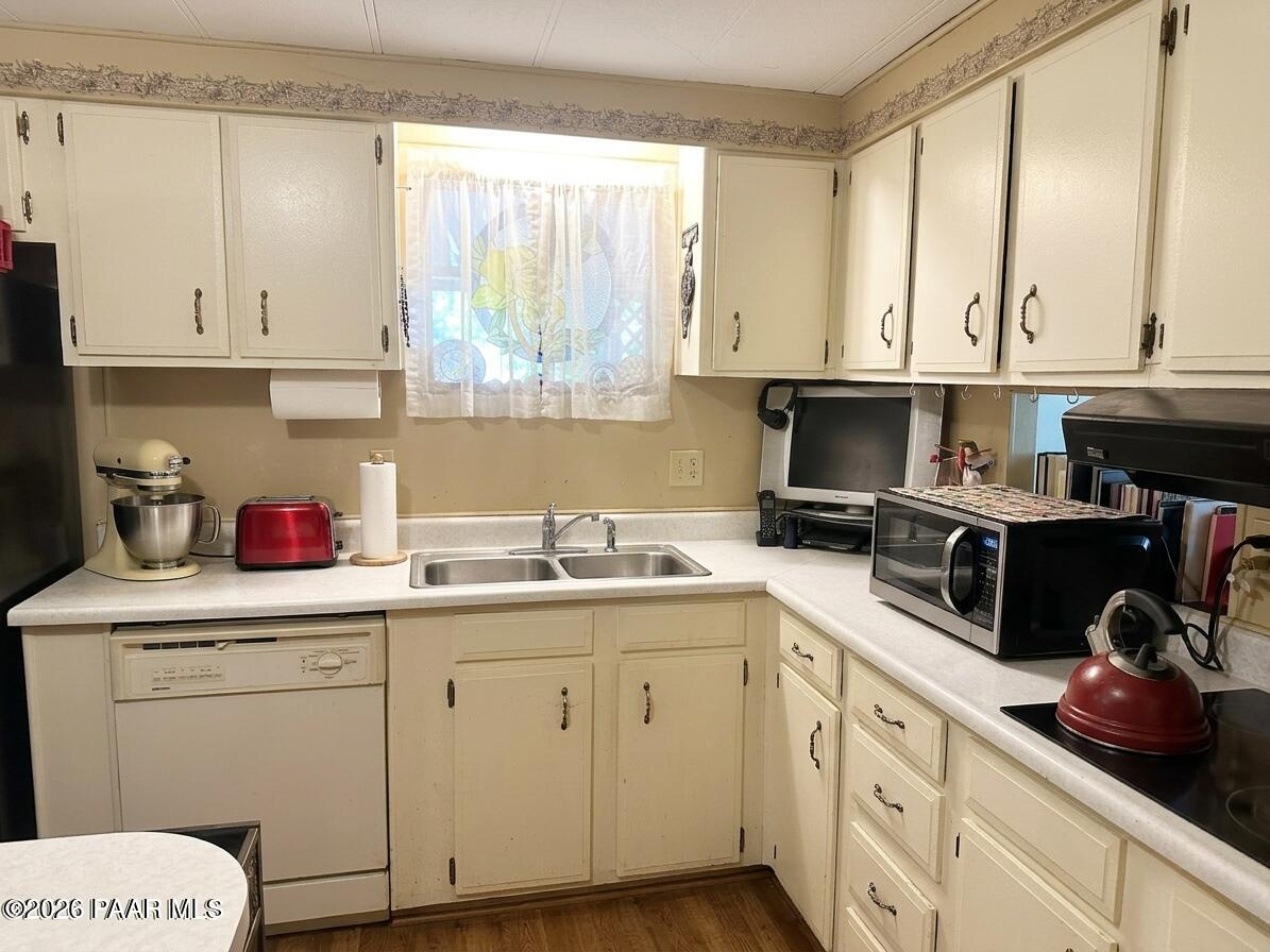 10075 Dapple Grey Trail Dewey, AZ 86327 - Photo 12 of 29 a kitchen with cabinets appliances and a sink