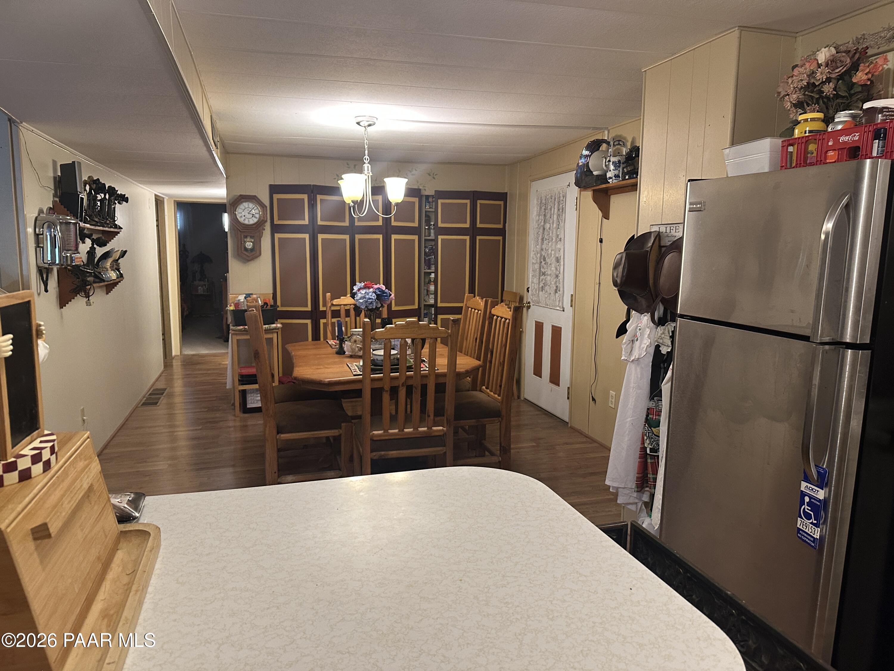 10075 Dapple Grey Trail Dewey, AZ 86327 - Photo 15 of 29 a living room with furniture a refrigerator and wooden floor