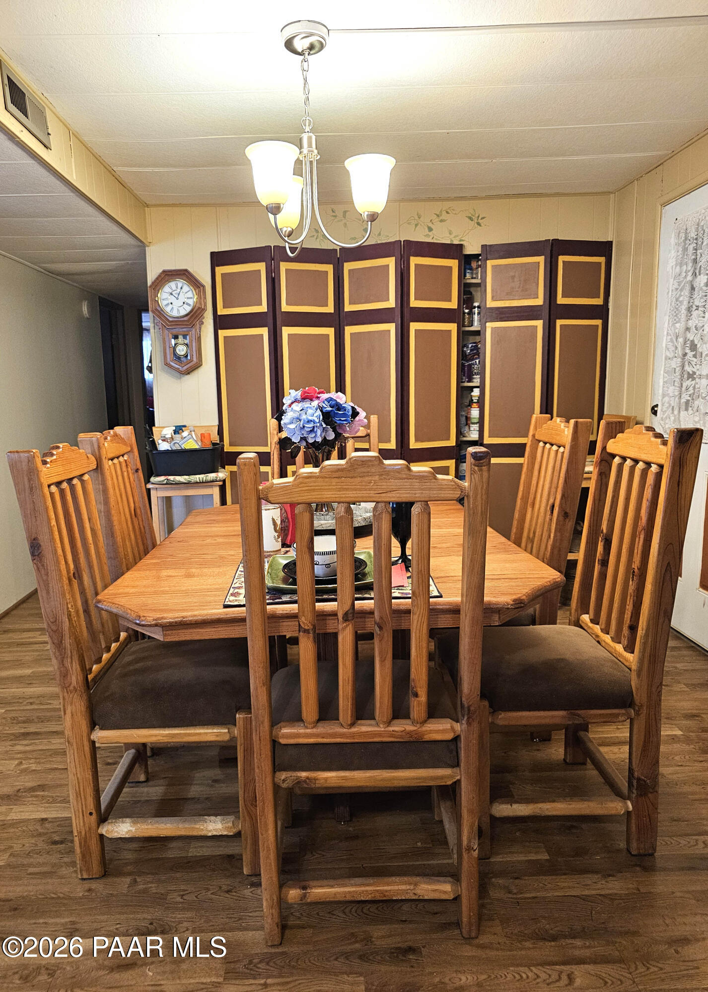 10075 Dapple Grey Trail Dewey, AZ 86327 - Photo 16 of 29 a view of a dining room with furniture wooden floor and chandelier