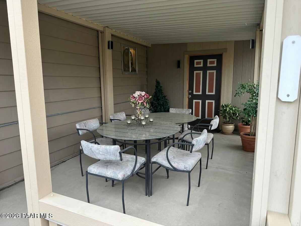 10075 Dapple Grey Trail Dewey, AZ 86327 - Photo 24 of 29 a view of a dining room with furniture and window