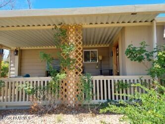 10075 Dapple Grey Trail Dewey, AZ 86327 - Photo 25 of 29 a front view of a house with a garden