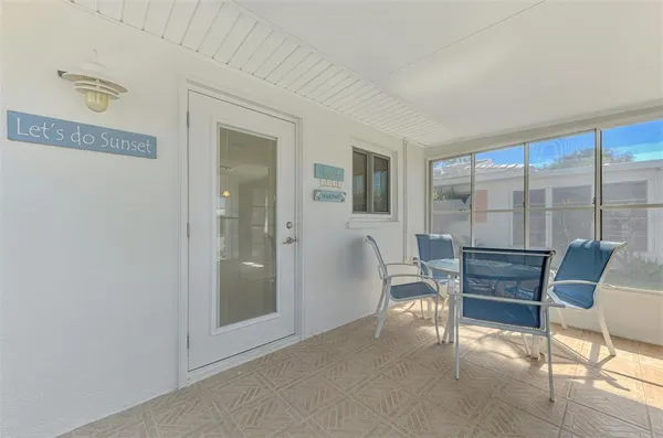 a view of a livingroom with furniture and a window
