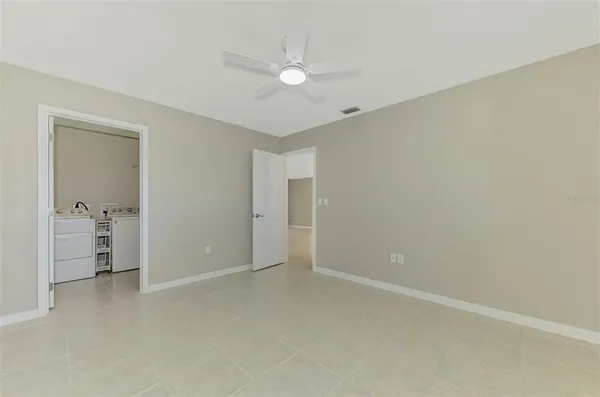 a view of swimming pool with outdoor seating and plants
