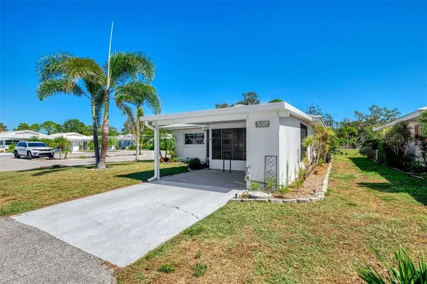 a backyard of a house with lots of green space