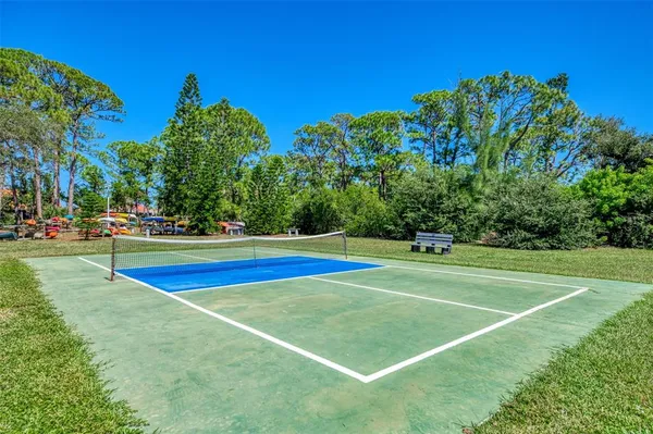 a view of outdoor space with playground and green space