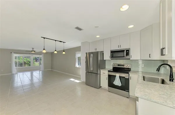 a view of a room with window and wooden floor