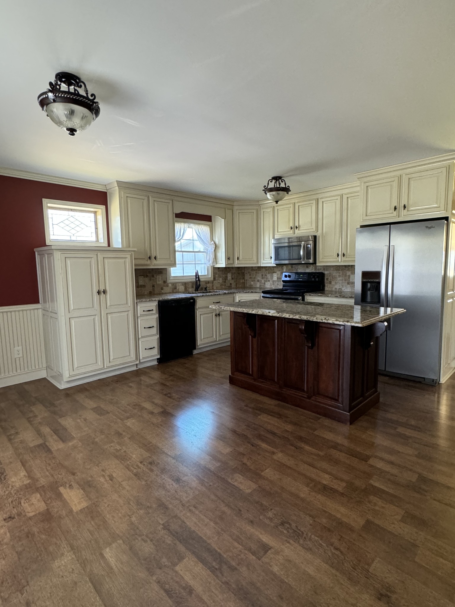 1792 Austin Road Lafayette, TN 37083 - Photo 3 of 34 a kitchen with stainless steel appliances granite countertop a stove top oven a sink dishwasher and a refrigerator