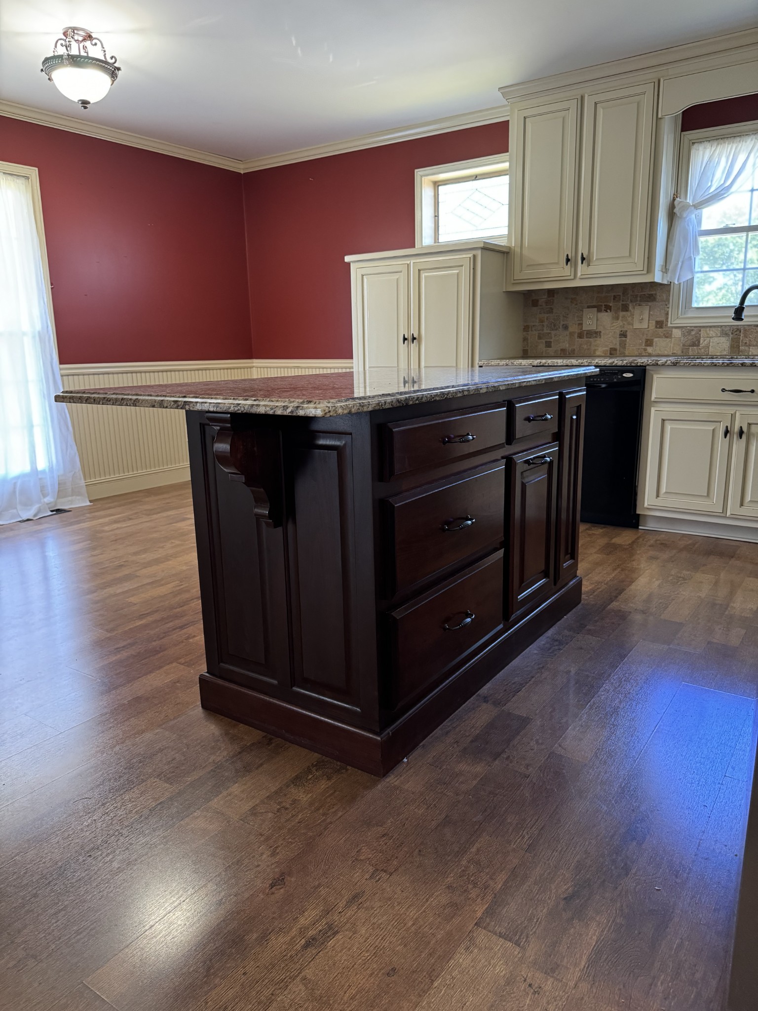1792 Austin Road Lafayette, TN 37083 - Photo 4 of 34 a kitchen with granite countertop a sink cabinets and wooden floor