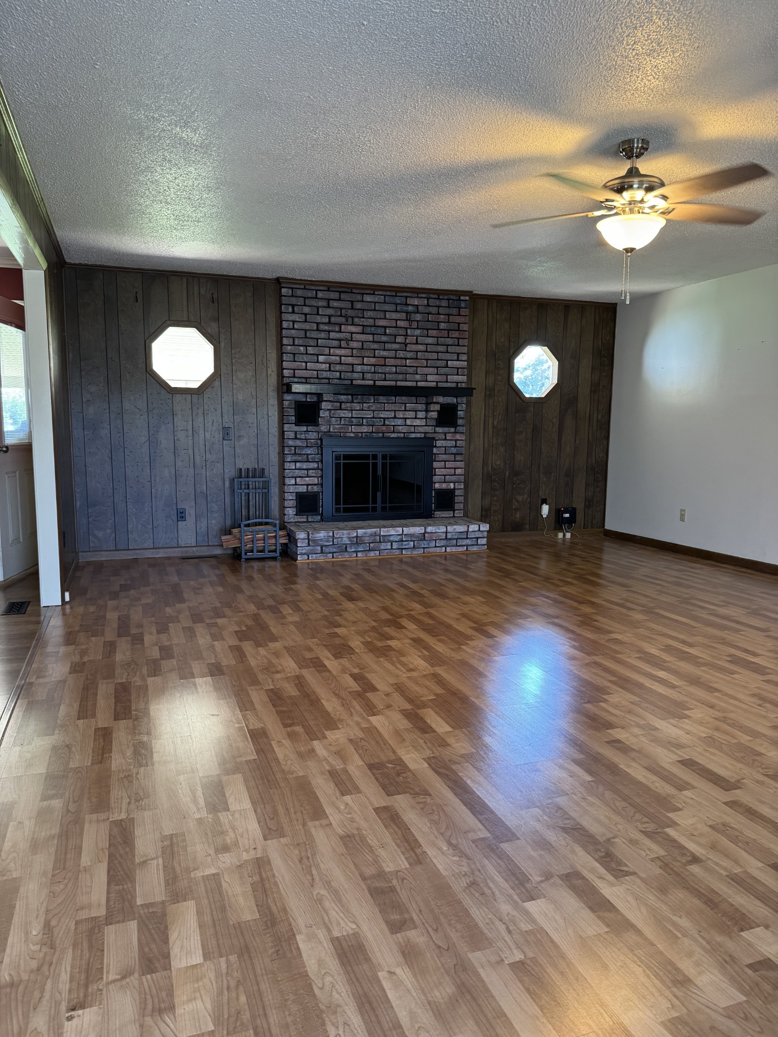 1792 Austin Road Lafayette, TN 37083 - Photo 7 of 34 a view of a room with wooden floor and a fireplace