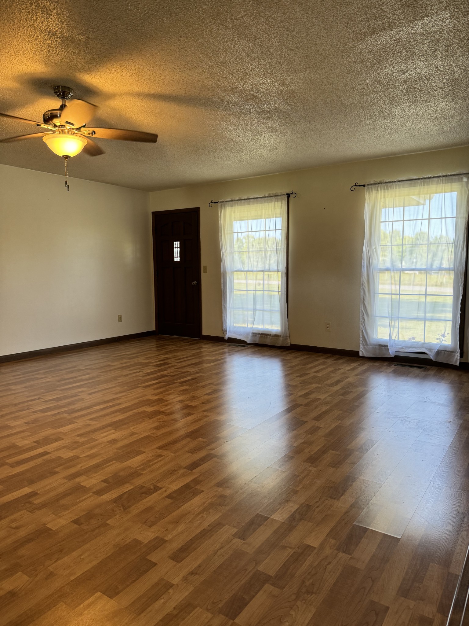 1792 Austin Road Lafayette, TN 37083 - Photo 8 of 34 an empty room with wooden floor and windows