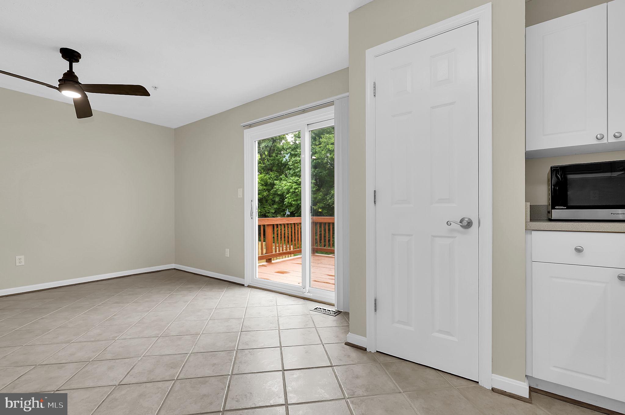 7150 Natures Road Columbia, MD 21046 - Photo 14 of 45 a view of an empty room with a fireplace